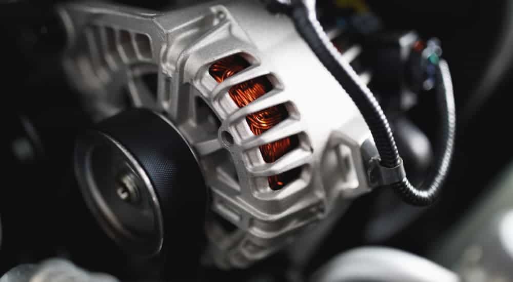An alternator is shown in closeup at a Cincinnati, OH garage.